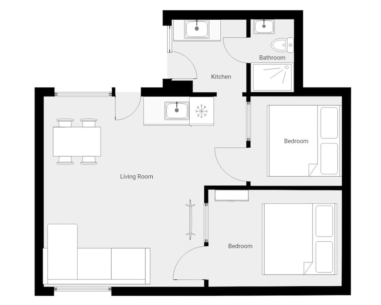Un plan d’étage d’une maison comprenant un salon, une cuisine, deux chambres et une salle de bain.