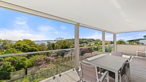 Outdoor dining - Family Retreat with water views at Corlette (Corlette)