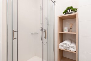 Shower, hair dryer, towels, soap