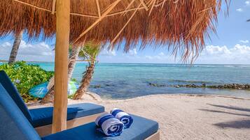 On the beach, sun loungers, beach towels