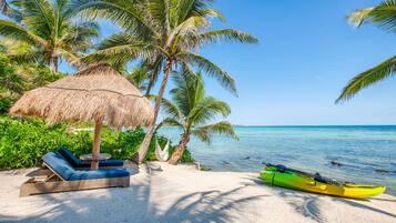 On the beach, sun loungers, beach towels