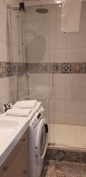 Shower, hair dryer, towels, soap