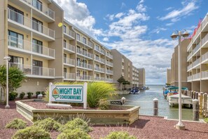Enjoy waterfront views from multiple balconies overlooking a serene marina setting.