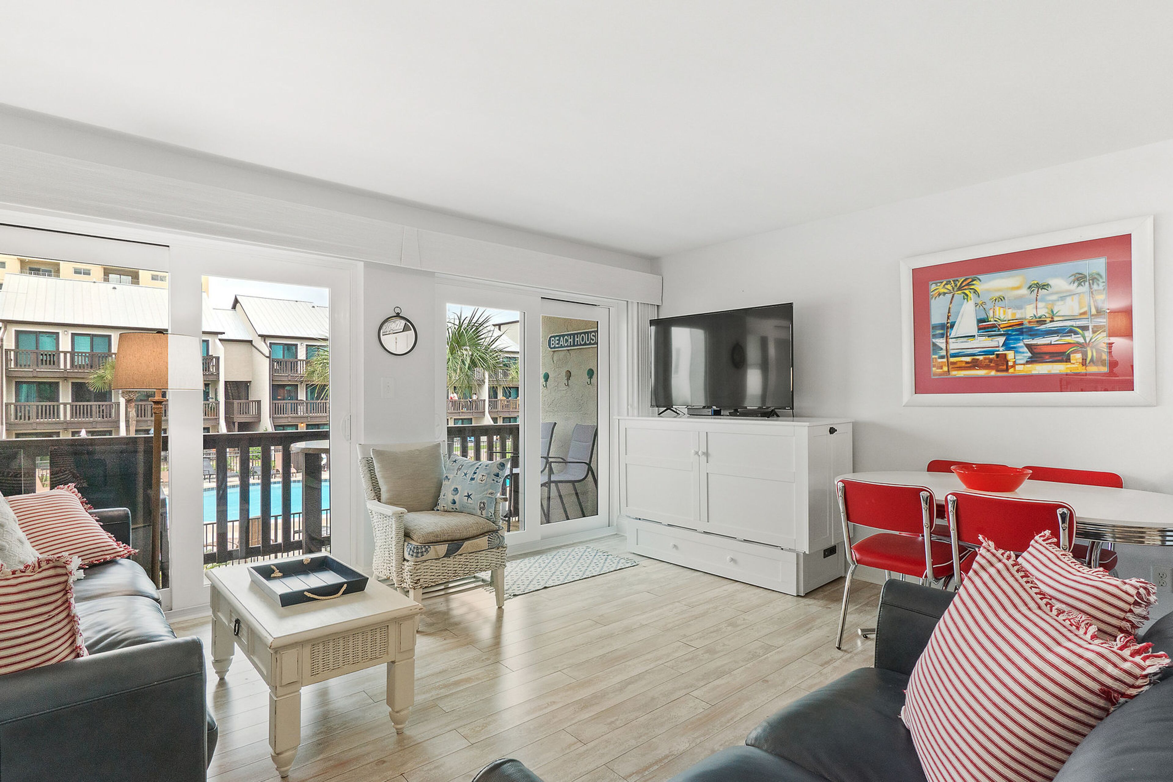 Beach bungalow with 2 separate balconies, shared pool & hot tub, WiFi, AC