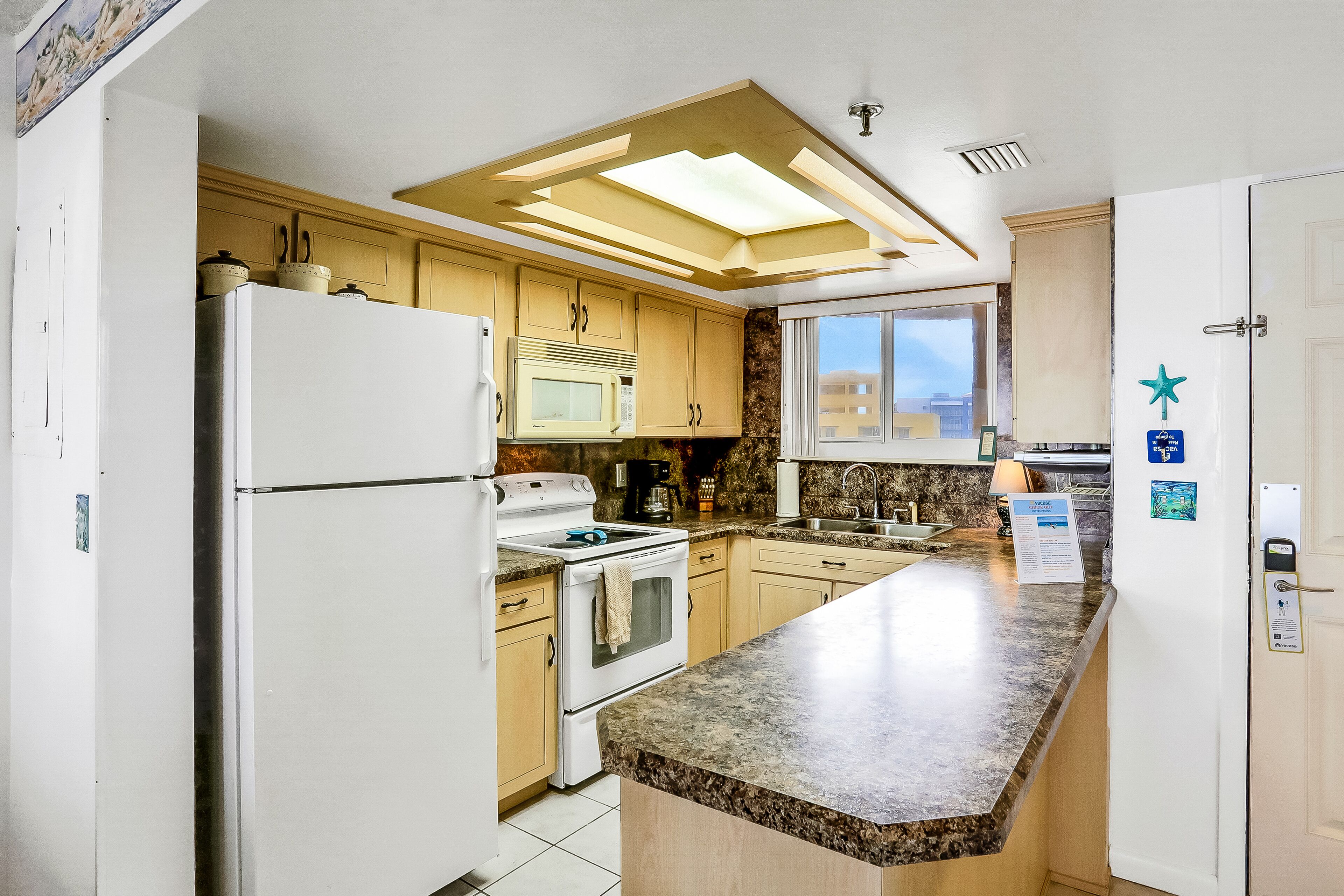 Condo in an oceanfront building with side ocean view, balcony, AC, WiFi & pool