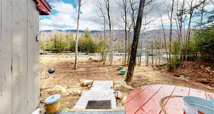 Riverfront condo with mountain view & ski shuttle: walk to town, hiking, skiing