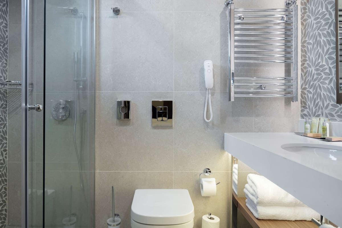 king two bedroom suite | bathroom | rainfall showerhead, free toiletries, hair dryer, bathrobes