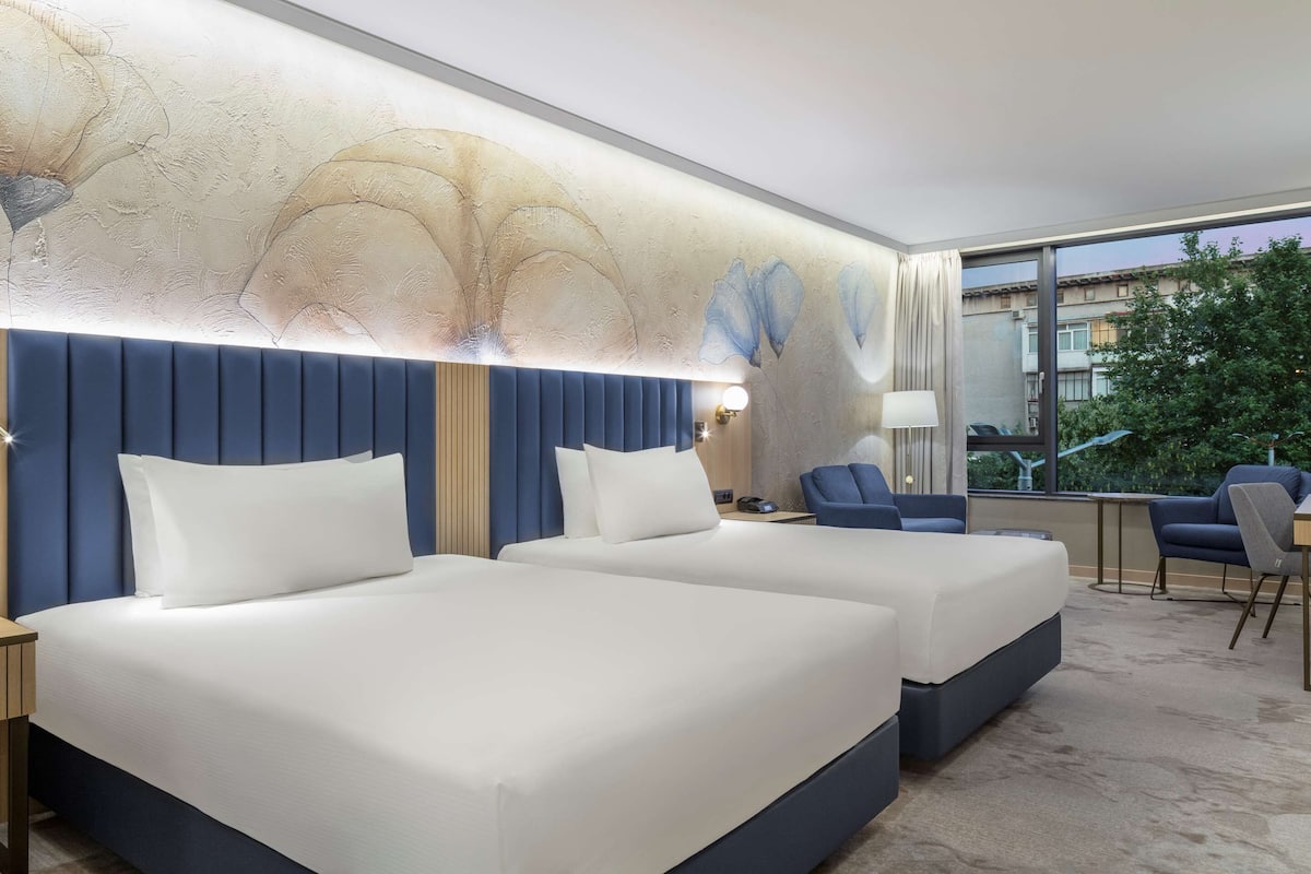 Deluxe Room, 2 Queen Beds | Premium bedding, memory foam beds, minibar, in-room safe
