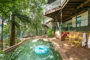 Spend a leisurely afternoon by the pool and soak up the sunshine. - Stoney Creek Cottage - Rainforest Retreat with Waterfalls, Swimming Holes & Serenity (Kamerunga)