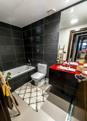 Combined shower/tub, hair dryer, towels, soap