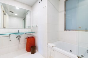 Bathtub, hair dryer, towels