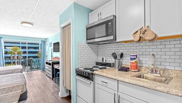 Coffee/tea maker, fridge, microwave, oven