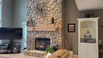 Smart TV, fireplace, DVD player, books