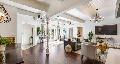 Stunning lakehouse lodge with a deck, fireplace, lush patio & lake access