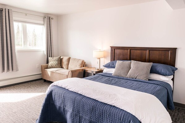 Single Queen Deluxe Suite | Premium bedding, memory-foam beds, desk, laptop workspace