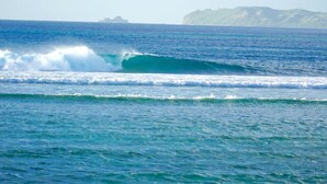 A coastal view with waves and distant land. - Merizo Seaside B&B - Unit 3 Ocean Villa (Tasi Merizo)