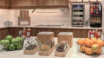 A kitchen with wooden cabinets, a white tiled backsplash, and various food items in containers.