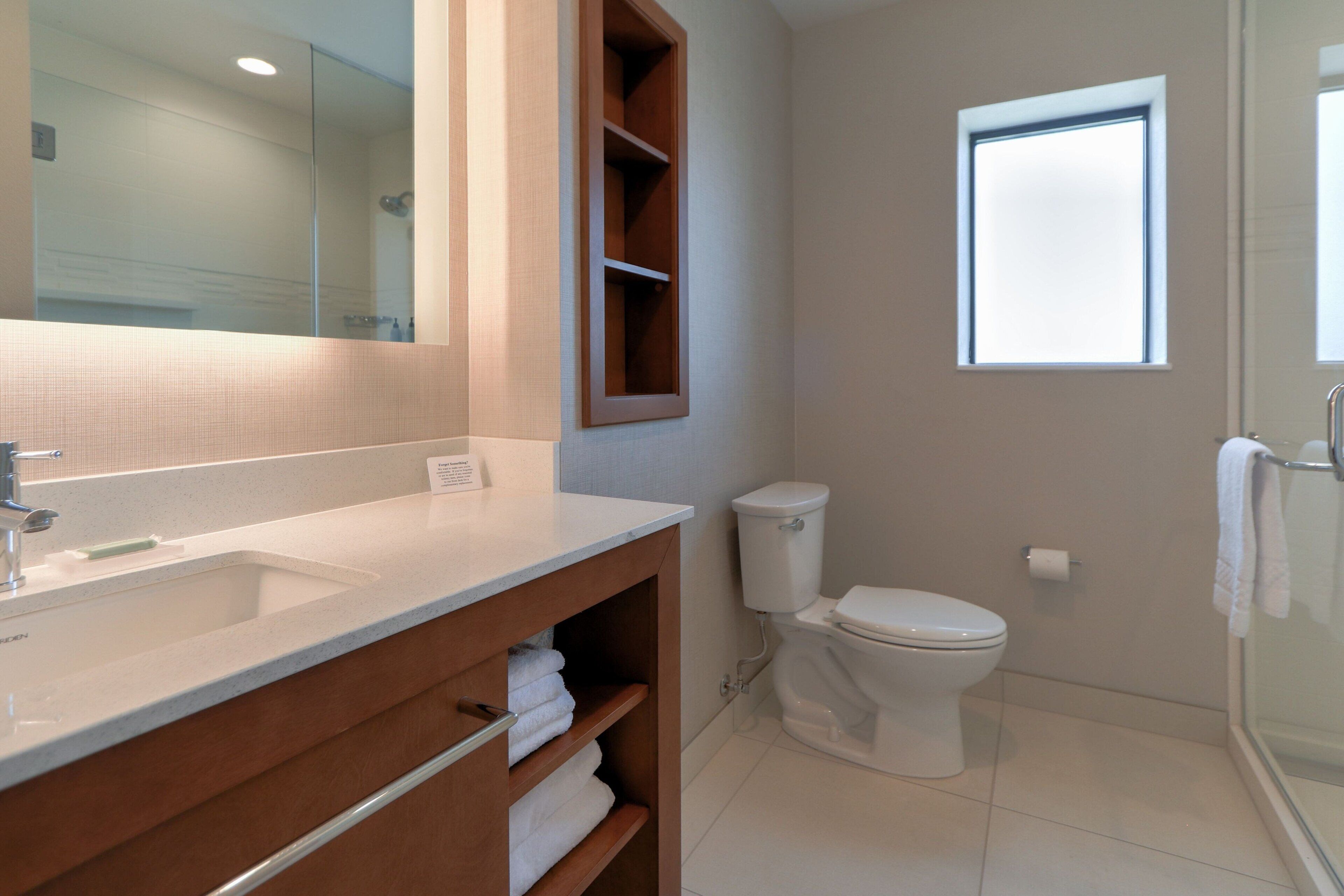 rainfall showerhead, designer toiletries, hair dryer, towels