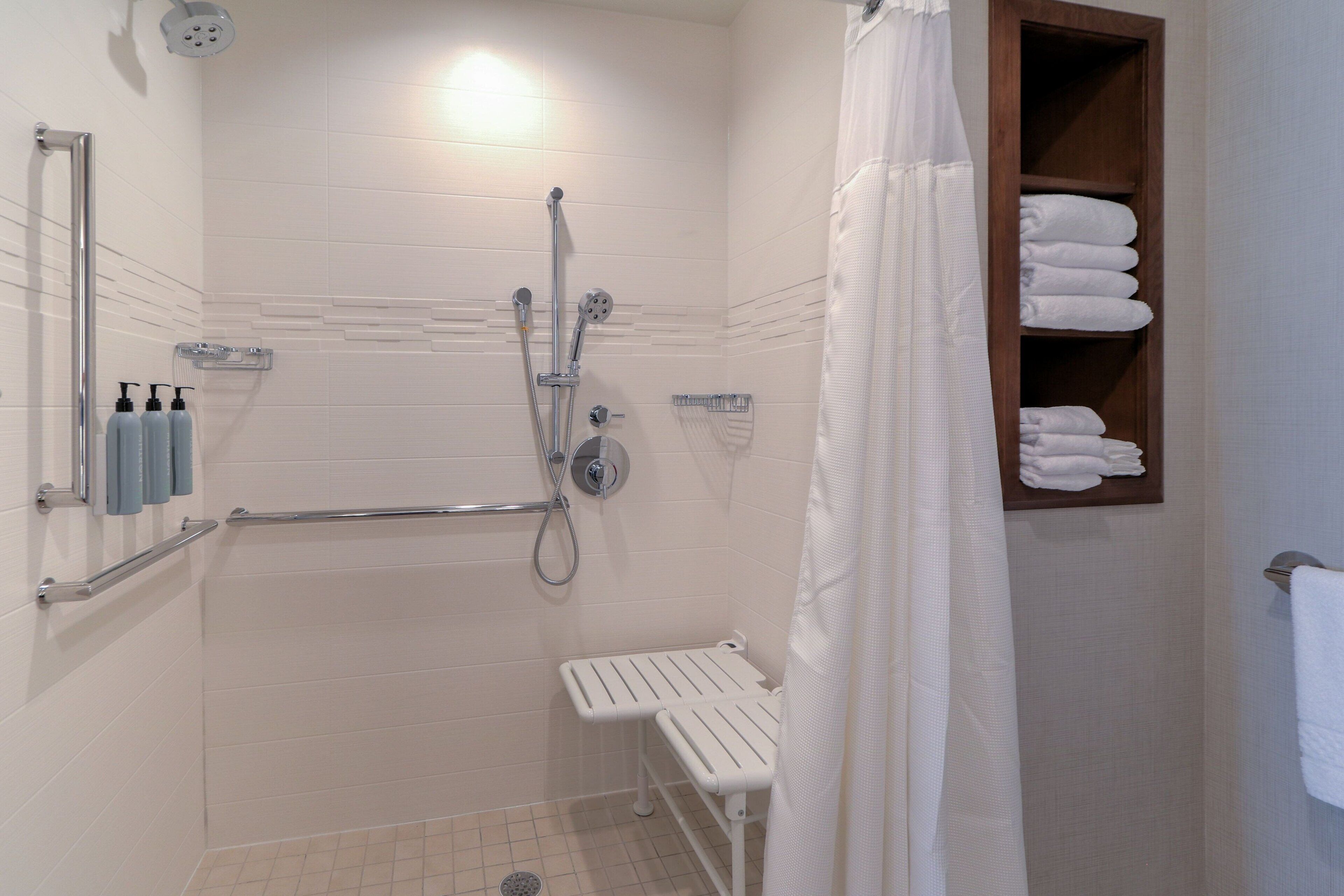 rainfall showerhead, designer toiletries, hair dryer, towels