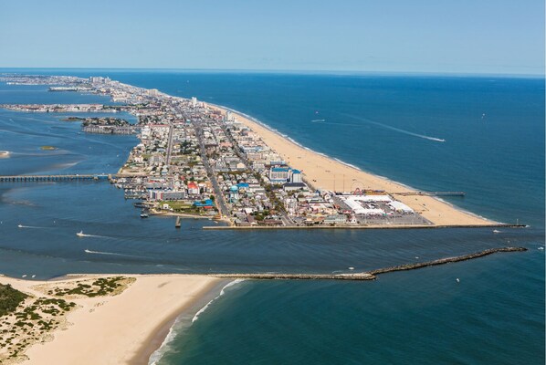 An aerial view of a coastal city with a long beachfront, a pier, and a dense urban area with buildings and roads. - Ocean! Ocean! Ocean! 🏖 Beautiful Condo!! (Ocean City)