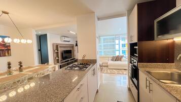 Microwave, oven, coffee/tea maker, cookware/dishes/utensils