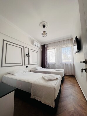 Economy Room (private bathroom outside the room) | Minibar, blackout curtains, iron/ironing board, bed sheets - Hüya Bozcaada (Bozcaada)