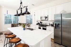 House, Multiple Beds, Pool Access, Pool View (Trade Winds Life) | Private kitchen | Fridge, microwave, oven, stovetop - Trade Winds Life Margaritaville (Kissimmee)