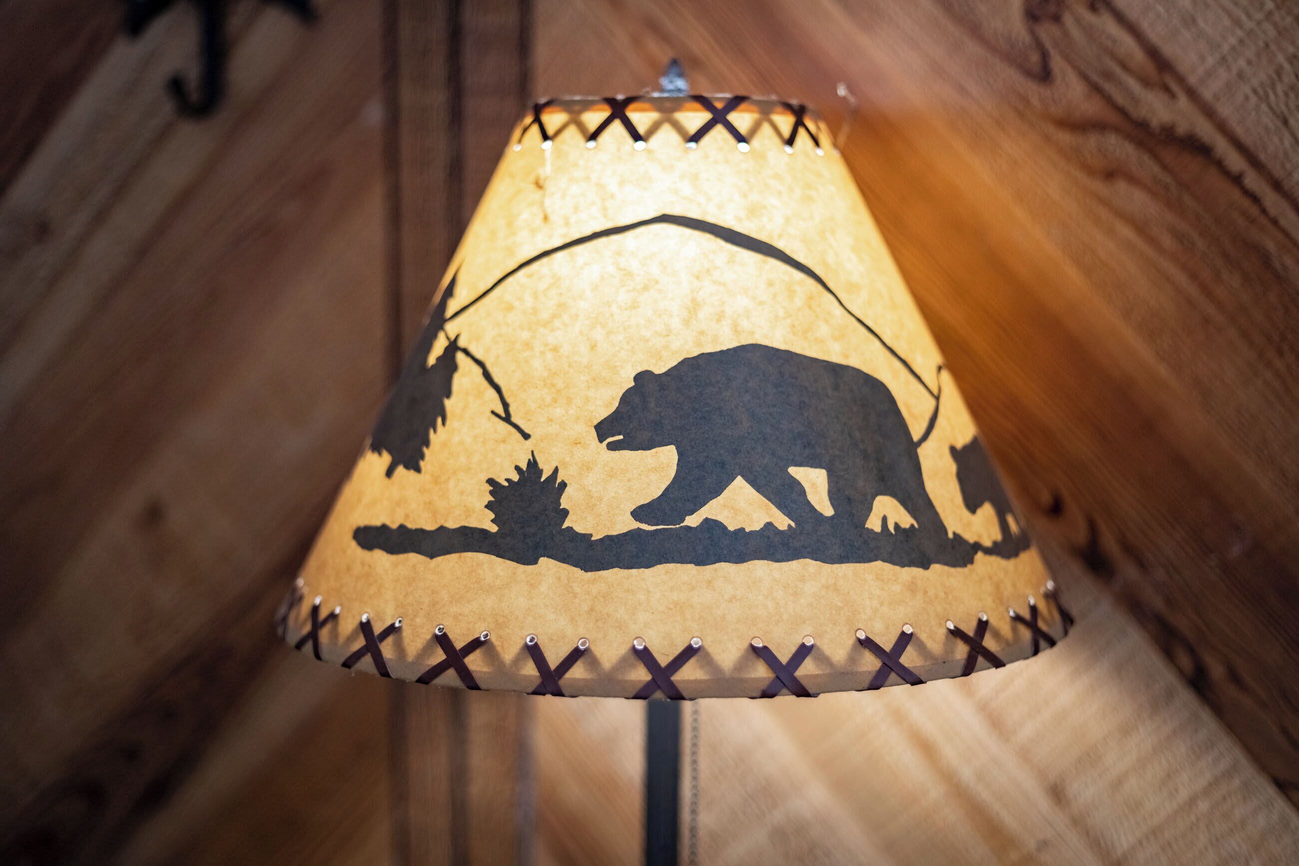 A lamp with a bear silhouette design.