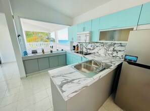 Microwave, dishwasher, coffee/tea maker, cookware/dishes/utensils