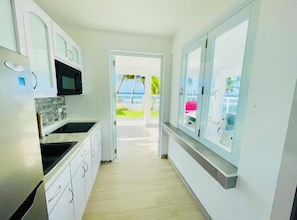 Microwave, dishwasher, coffee/tea maker, cookware/dishes/utensils