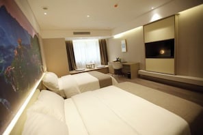 A hotel room with two beds, a desk, a chair, a TV, and a painting on the wall. - Saint Hotel (Chongqing)