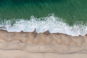 On the beach, sun-loungers, beach towels