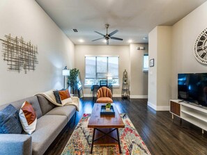 52-inch Smart TV with digital channels, streaming services - Cozysuites Uptown 3BR King Beds Skyline View (Dallas)