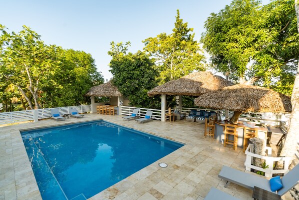 Outdoor pool, open 9:00 AM to 7:00 PM, pool loungers