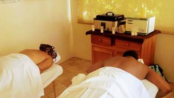 Experience a serene spa setting with two massage tables, a soothing ambiance, and a tranquil atmosphere.