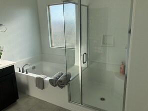 Combined shower/tub, hair dryer, towels, soap