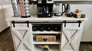 A coffee station with a coffee maker, a grinder, and a mug rack. - Luxury Stay w/Coffee Bar & Movie Room, 2 King Suites, Firepit — Black Hills View (Rapid City)