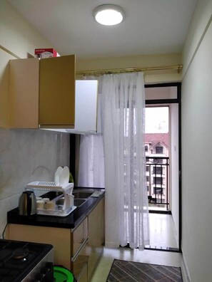 Business Apartment | Private kitchen | Fridge, microwave, cookware/dishes/utensils, dining tables - Stay.Plus Hurlingham Business Apartment (Nairobi)