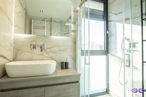 Shower, hair dryer, towels, soap