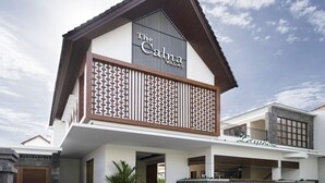 A hotel with a modern design, featuring a prominent 'Cana Villas' sign on the facade. - The Calna Villa (Kuta)