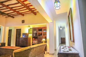 Family Villa | Living area | 14-inch Smart TV with digital channels, TV - Stay.Plus Kivulini Cottages Diani Beach (Diani Beach)