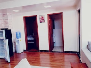 Deluxe Apartment | Living area | 14-inch Smart TV with digital channels, TV - Stay.Plus Kilimani Luxe Apartment (Nairobi)