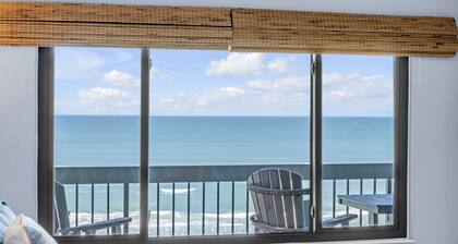Direct oceanfront corner condo with big balcony, heated beachfront pool and garage parking