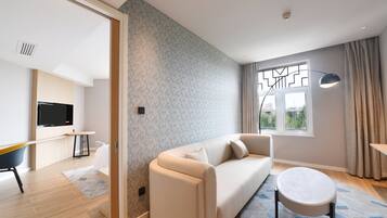 Suite, 1 Bedroom (Living Area) | 1 bedroom, in-room safe, desk, blackout drapes