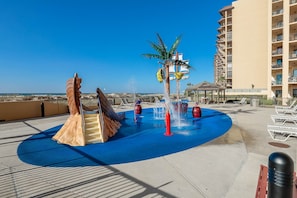 Relax by the pool and enjoy the rooftop water play area with a slide and water jets.