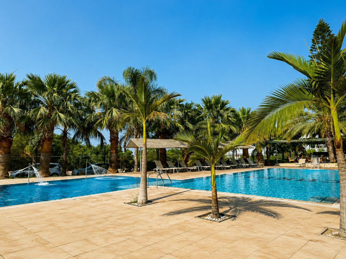 2 outdoor pools, pool umbrellas, pool loungers
