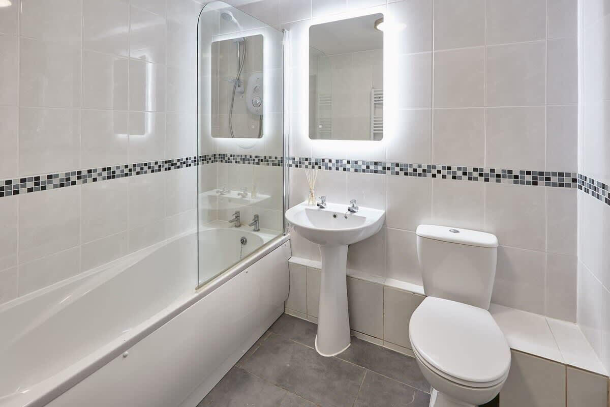 Bathtub, hair dryer, towels