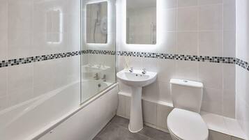 Bathtub, hair dryer, towels