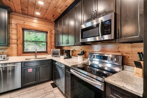 Fridge, microwave, oven, stovetop - Smoky Mountain Haven - 8 BD Cabin in Pigeon Forge (Sevierville)