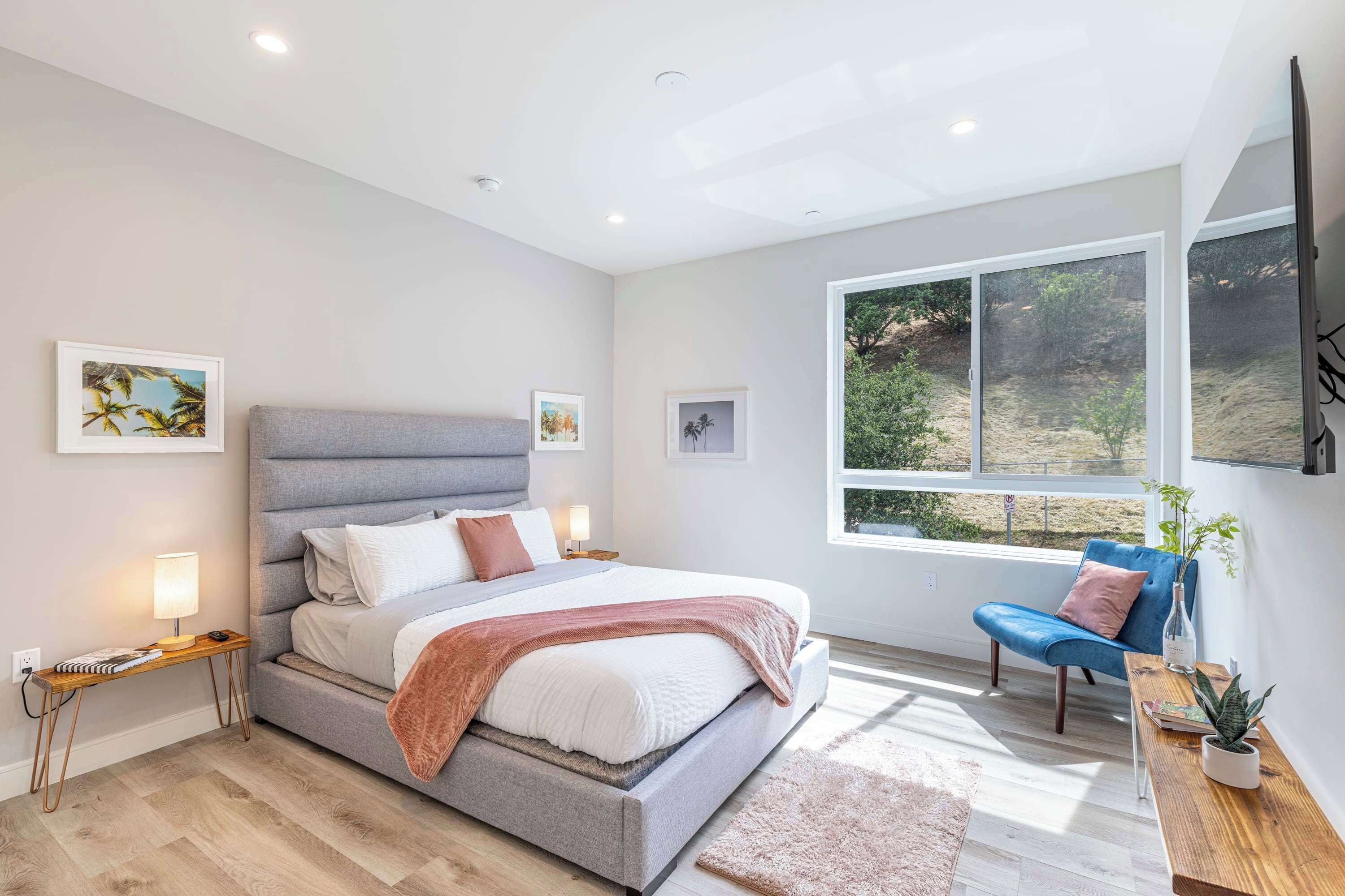 Beautiful bedroom w/ room darkening shades facing the quiet and picturesque hillside, TV, ample charging ports for your devices